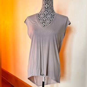 BCBGMaxazria sleeveless summer top w sheer panel on back and shoulder detail.